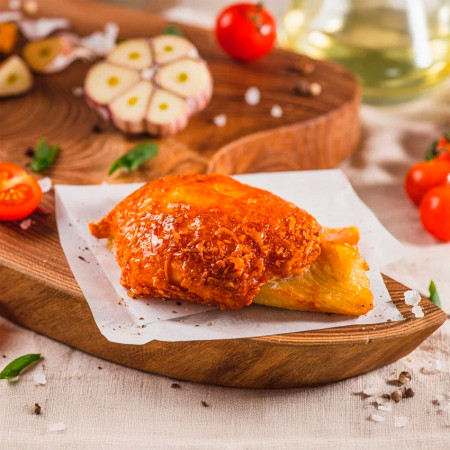 Тилапия с томатами под сыром